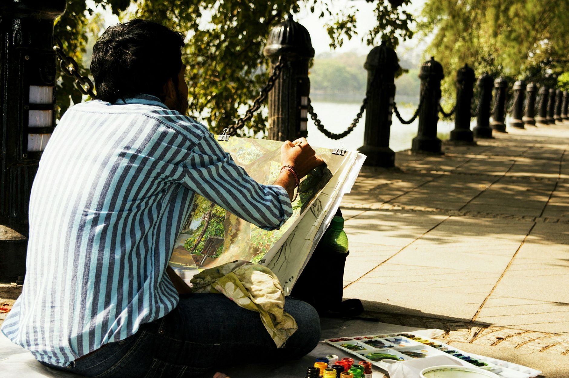 A person painting an exterior wall